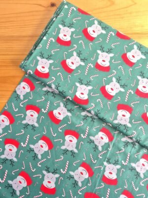 Tela Sarga con diseño de renos y bastones de caramelo vista desde arriba