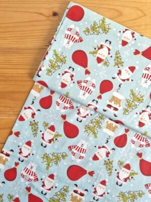 Tela Sarga con diseño de Viejito Pascuero y sacos de regalos vista desde arriba