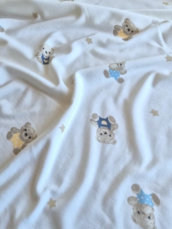 Tela interlock con estampado de ositos y estrellas en forma de olas