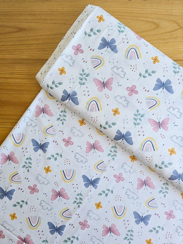 Tela Sarga Mariposas, Arcoíris y Nubes Fondo Blanco